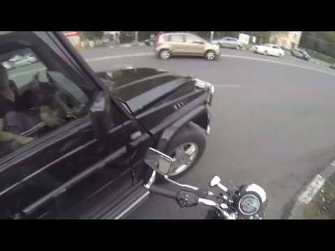 A Woman Rides Around on a Motorcycle, Looking for Litterbugs & Then Throws Their Trash Back in Their Car!