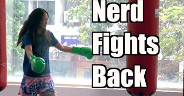 Muay Thai fighter dresses as nerdy chick & puts in work on an unsuspecting trainer
