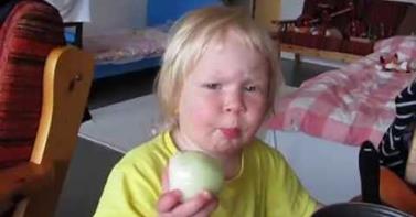 VIDEO: A Little Girl Eats a Raw Onion & Looks Miserable . . .