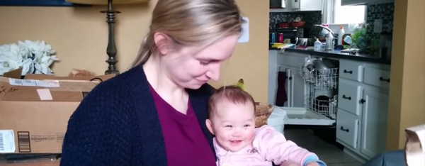 WATCH: Baby Can't Stop Laughing at Her Mom Eating Chips