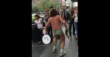 WATCH: Street Performer Marches Into Stores Screaming at the Top of His Lungs