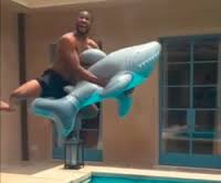 WATCH: Usher Jumps Into Pool In Slow Motion