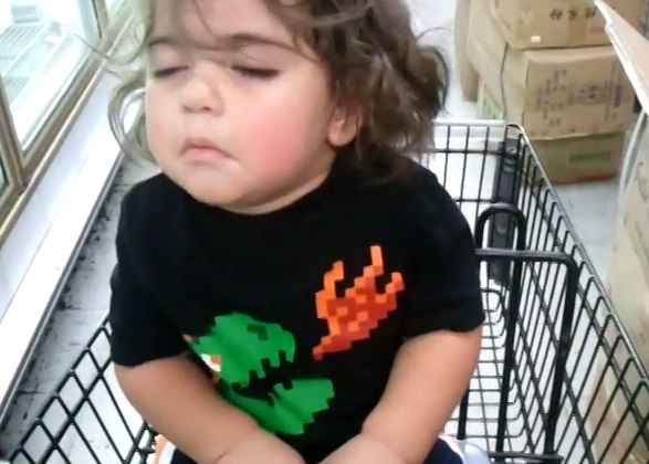 Sleepy boy in cart.....